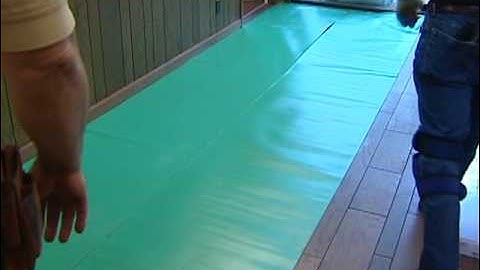 Laminate Flooring Installation -- Installing Underlayment (Airbase Carpet and Tile)