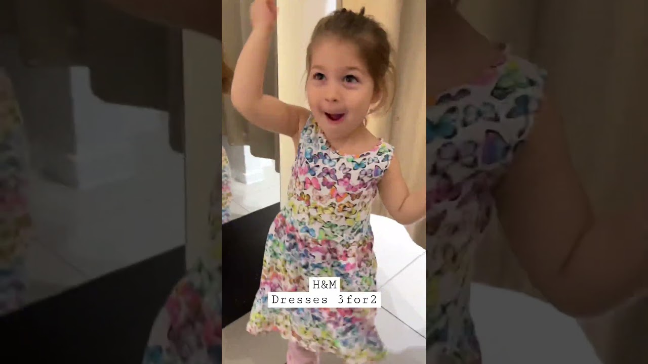 Trying dresses at H&M , only 3for2 