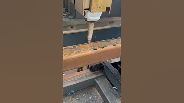 drilling a hole in a piece of iron using a high-pressure laser tool to make the hole