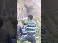 People watch mountain fall apart