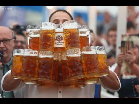 Prost! German beats his own world record for carrying beer steins