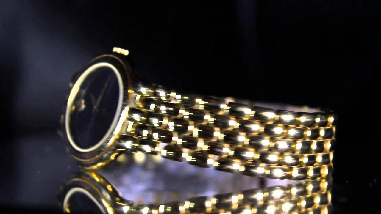 STAINLESS STEEL MOVADO WATCH! BEAUTIFUL GOLD LOOK! NO RESERVE! UNIQUE STYLE!