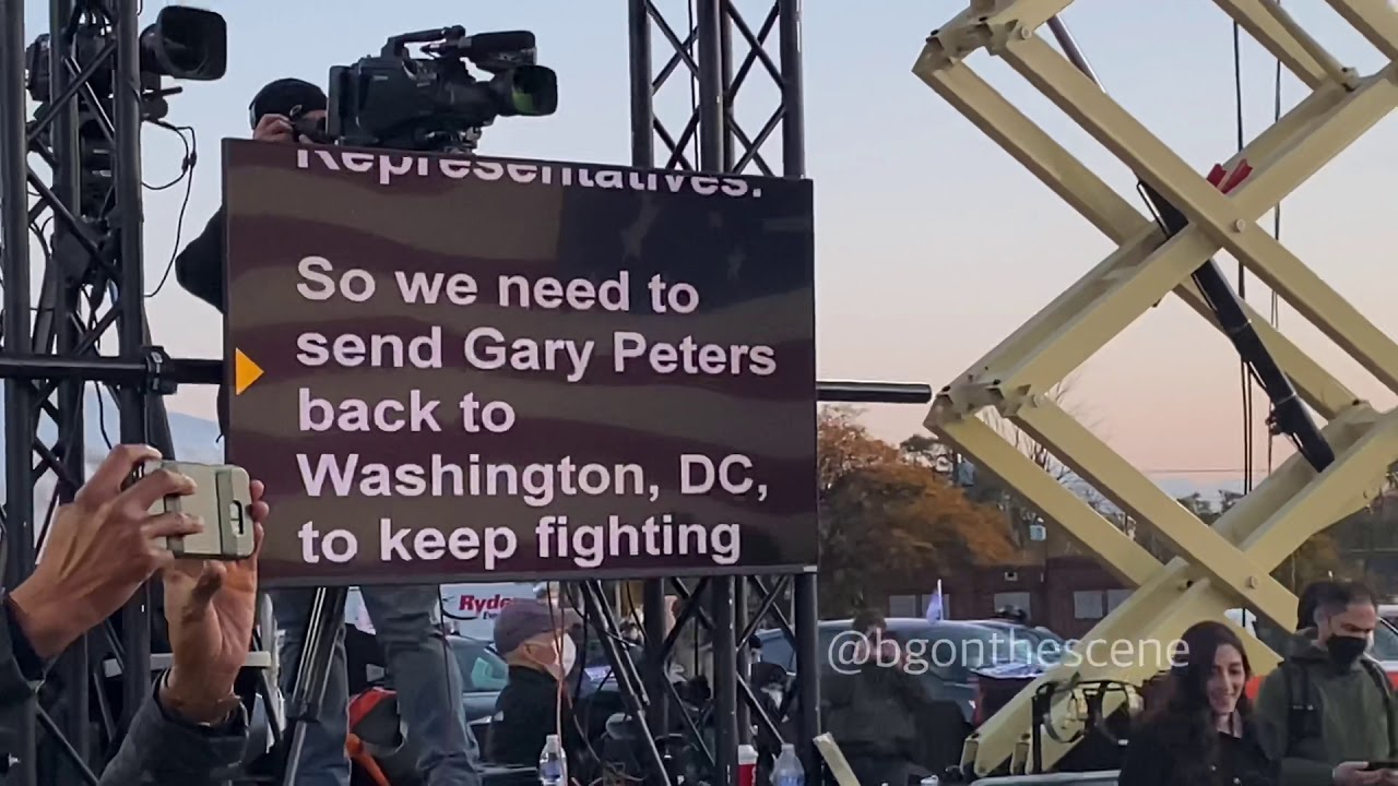 Joe Biden reads from a flat-screen tv teleprompter as he delivers remarks i...