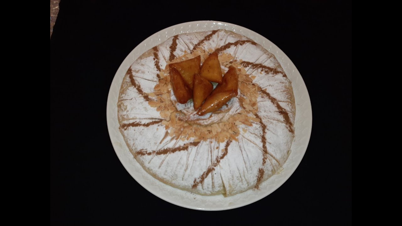 بسطيلة بالدجاج و اللوز .على حقها وطريقها. مزينة ببريوات اللوز بمقادير مضبوطة 👌👌