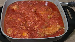 Smothered pork chops in tomato gravy