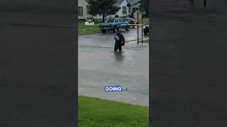 Brave mailman braves heavy floods to deliver post