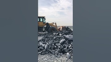 The Skills Operator SDLG Wheel Loader Pushing On Site .