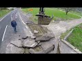 Tearing out asphalt for sewge pipes with (Volvo EW160 Tiltrotator)