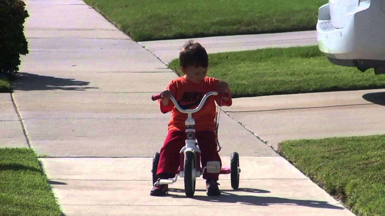Boy riding tricycle YouTube