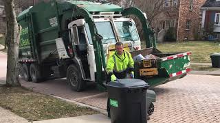 2 Roaring Peterbilt 320 McNeilus Front Load Garbage Trucks