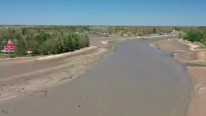 Wixom Lake becomes muddy field after dam failures