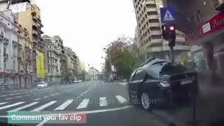 BMW loses control and crashes into a traffic light pole