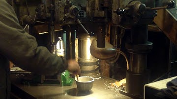 Vintage Clausing drill press with power feed at work.