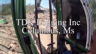Loading a 15,000 pound log with a John Deere 2154D!