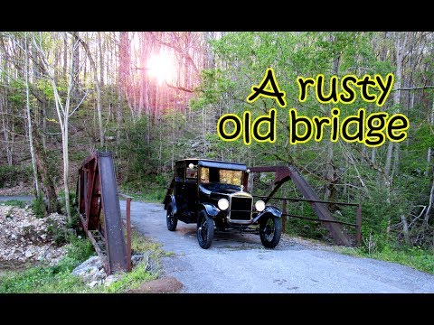 Model T Ford crossing a bouncing, rusty old bridge near New Market
