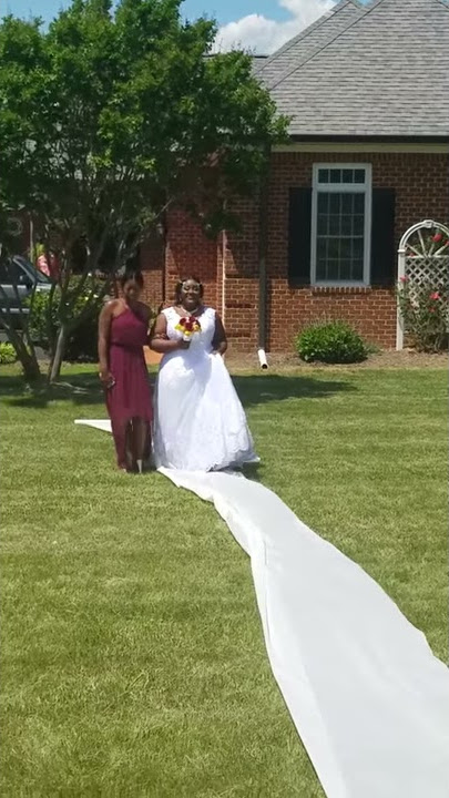 Tiara  and mother walking down the aisle May 2018