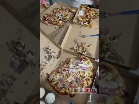 VIDEO. Așa nu! Pizza livrată într-un hal fără de hal, la Satu Mare