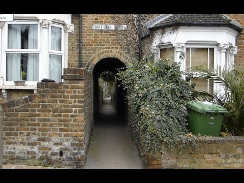 RARE Alley to a railway crossing in London