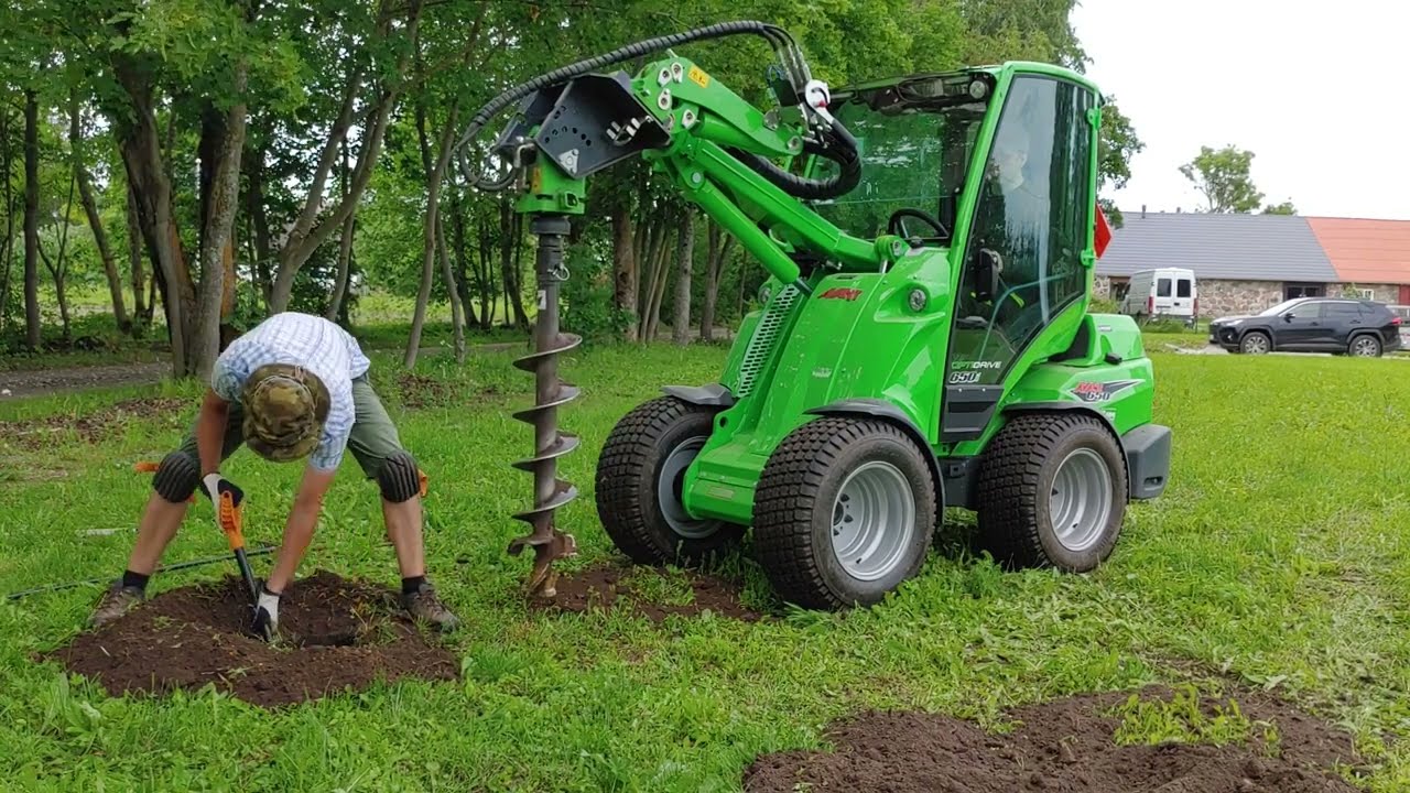 Avant 650i drilling fence post holes