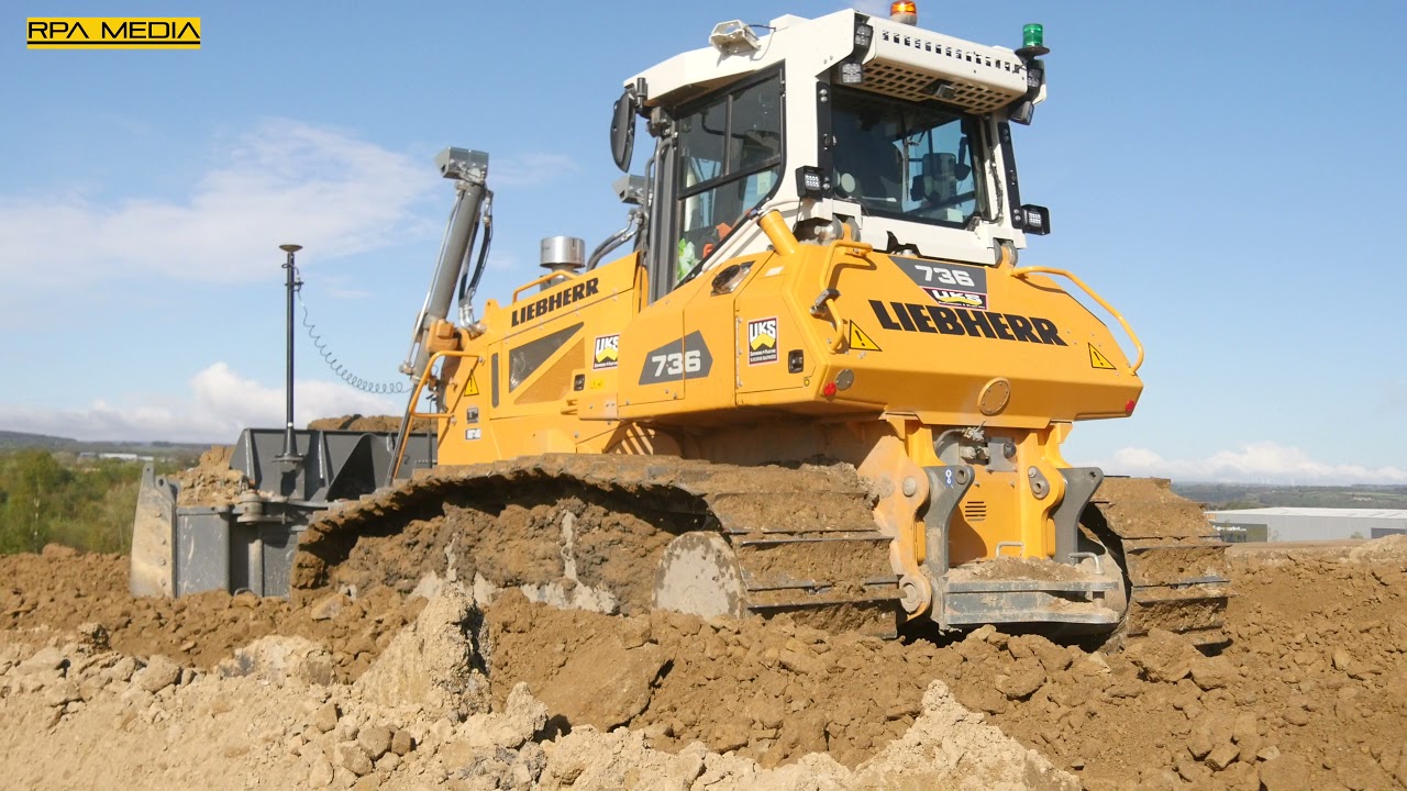 LIEBHERR 736 dozer spreading material out on a new distribution