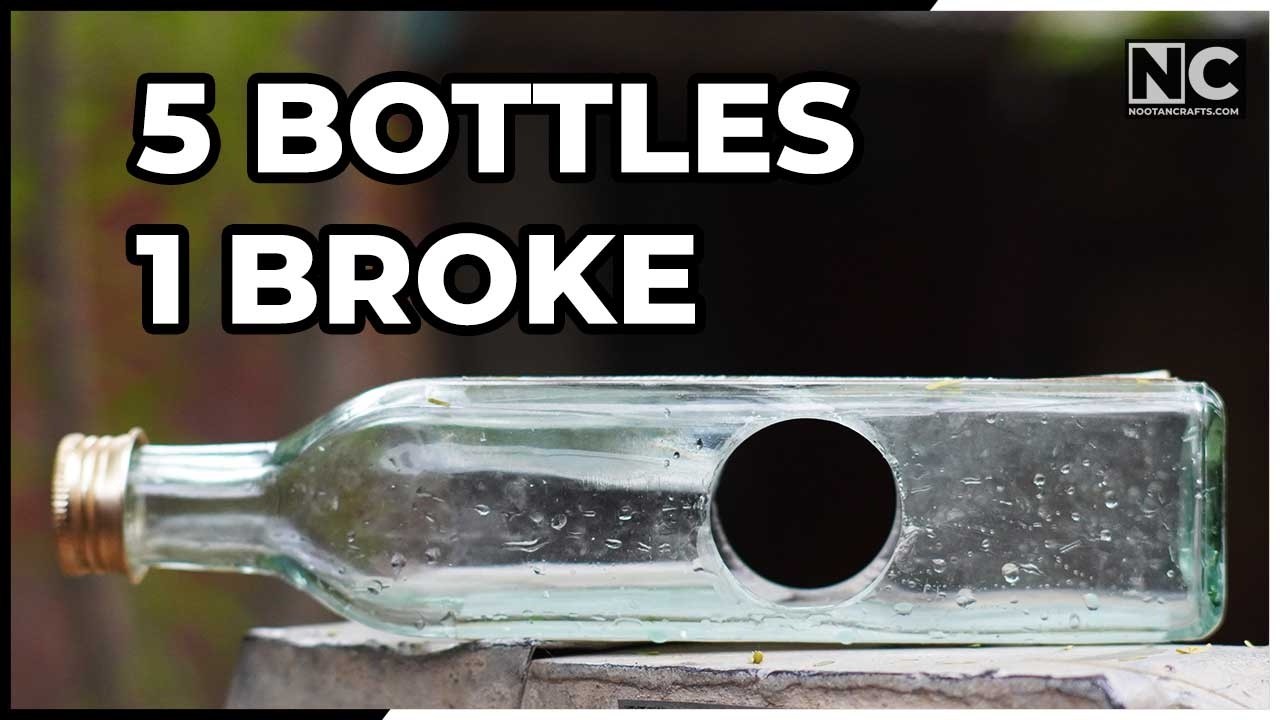 Drilling a glass bottle with a diamond hole saw under running water