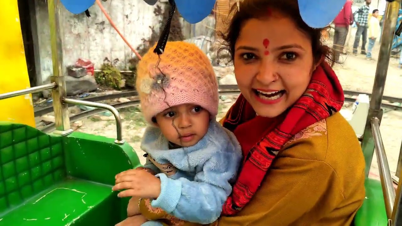 Enjoying Holi mela with Dhruv