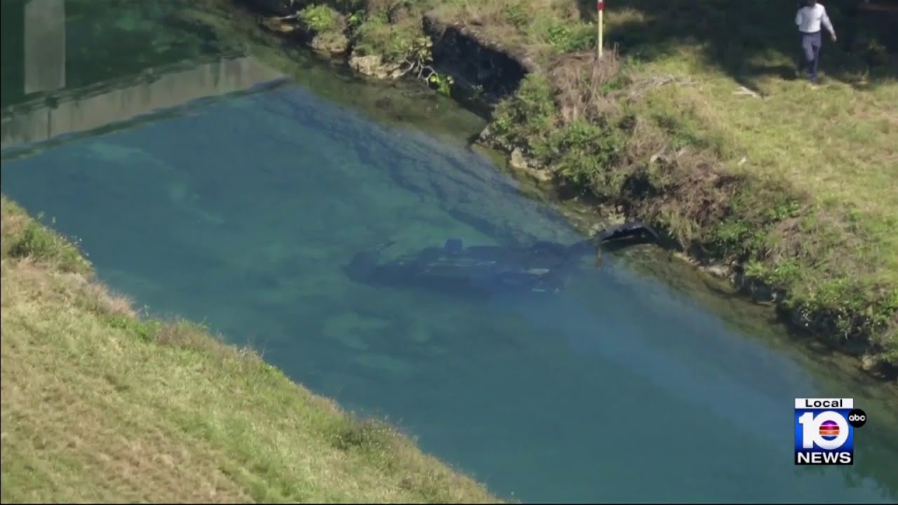 Man dies after car plows into canal off Turnpike - YouTube
