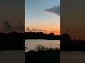 crescent moon over a lake