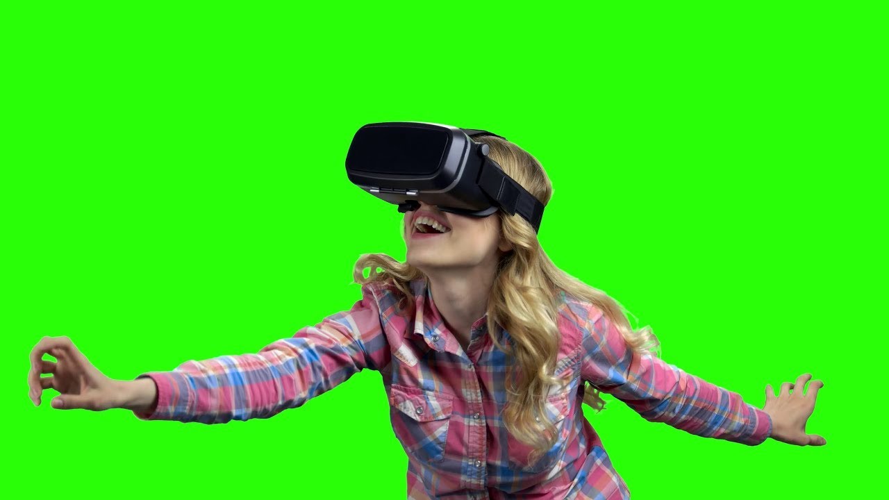 Woman wearing Vr glasses on green screen - Woman wearing Vr glasses on Chroma key no Copyright