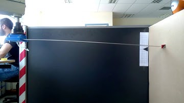 Free vibration of a beam that is moved by a robot