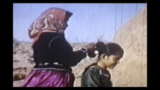 1950's home movie of a Navajo woman making a Tsiiyeel hair bun.