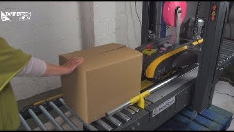 Tamper evident box tape being applied by machine