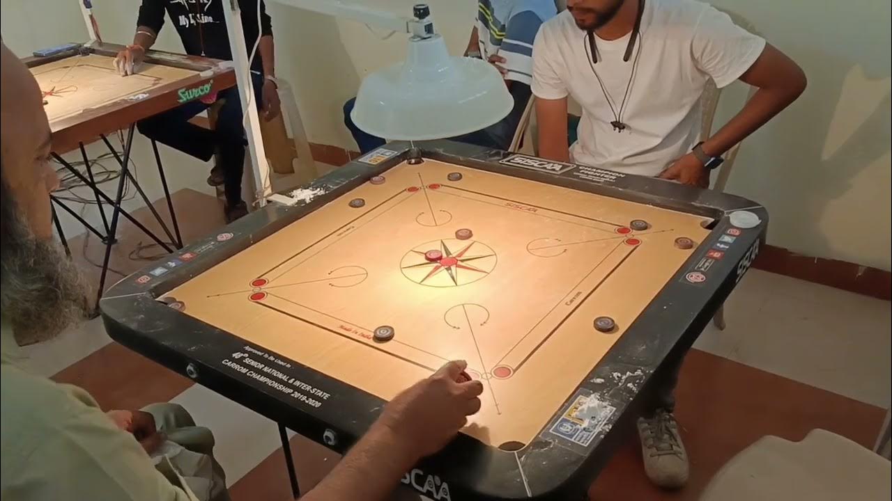 Two best player play in carrom game YouTube