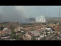 Smoke plumes drift over shattered Gaza skyline