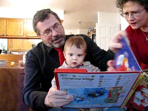 Grandpa and Logan read a Christmas book