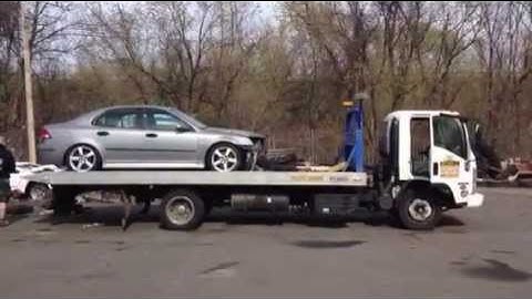 Unloading a car off of a flatbed