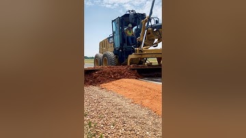 Watching that motor grader make art out of shoulder materials. #motorgrader #construction