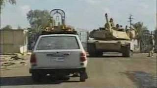 U.S tank crushes Iraqi civilian's car.