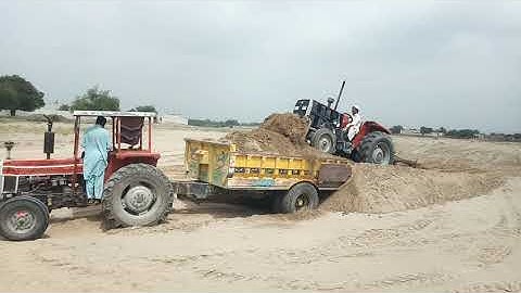 Efficient Sand Loading with MF 375 Tractor on Trolley - Streamlining Construction Operations