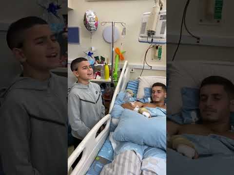 He sings to the IDF soldier, who was wounded in battle, and make him happy #israel