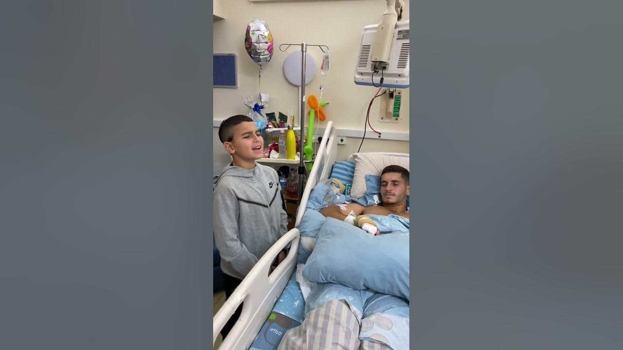 He sings to the IDF soldier, who was wounded in battle, and make him happy #israel
