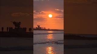 Beachgoers and surfers saying goodbye to 2025