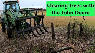 John Deere 4066R and Rake Master root rake clearing stumps! #256