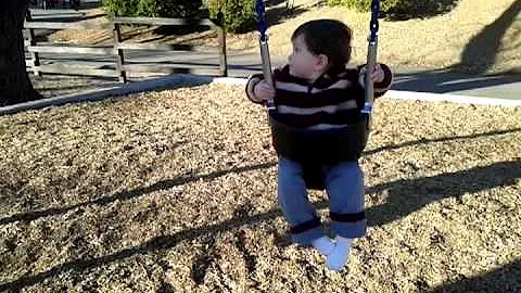 Leo's first swing ride at the park (1/16/2012).