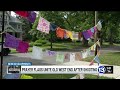 Old West End prayer flags remain up as neighbors add messages after shooting