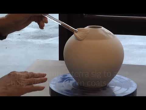 Video thumbnail showing horsehair laid onto a hot burnished pot and curling into black smoke lines