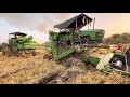 John Deere harvester stuck in mud pulling out by another John Deere harvester | tractor videos |