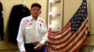 Tattered old flag by Harvey Benne