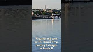 A pusher tug seen on The Illinois River, pushing its barges in Peoria, Il.