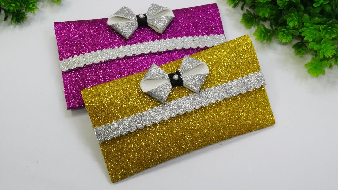 DIY Kitty Gift Bag | DIY Gift Bag | Gift Ideas | DIY Kitty Gift Bag  Supplies Needed: Zip Lock Bag Silicon Glue Glitter Foam Sheet Scissors  Black Thread Marker Kitty Gift... |
